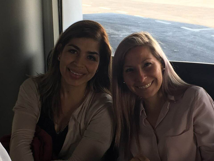 Eva sitting next to a friend